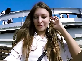 Talia virgin plays in public with remote control toy over the telephone with fan